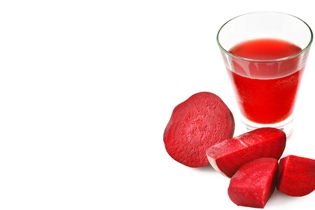 Red beet and fresh juice in a glass isolated on white background. Flat lay, top view. Free space for text.の写真素材