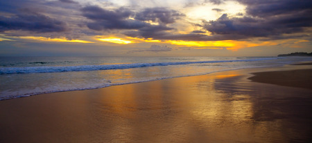 Beautiful sandy beach of the Indian Ocean and a fantastic sunset. Wide photo.の写真素材