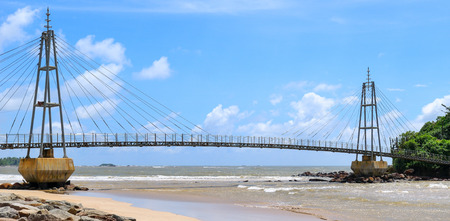 Bridge to the island with a Buddhist temple, Matara, Sri Lanka. Wide photo.の写真素材
