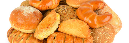Bread and bakery products isolated on white background . Wide photo .の写真素材