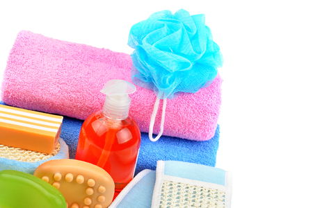 Cotton towels, cosmetic soap, sponge and shampoo isolated on white background. Free space for text.の写真素材