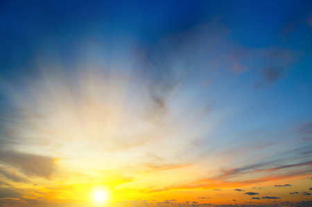 Cloudy sky and bright sunrise over the horizon.の写真素材