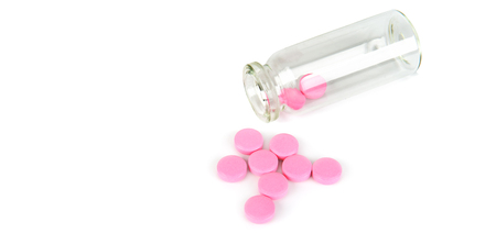 Medical preparations, pills in a glass bottle isolated on white background. Flat lay, top view. Free space for text. Wide photo .の写真素材