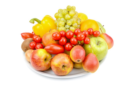 A set of fruits and vegetables on a platter isolated on white background.の写真素材