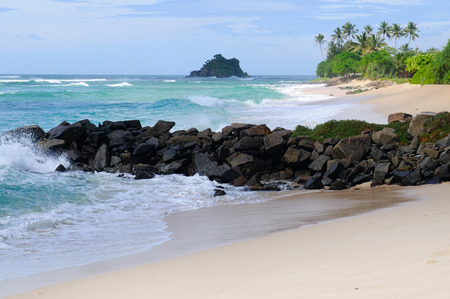 Ocean, picturesque beach and blue sky. Coastline of Sri Lanka.の写真素材