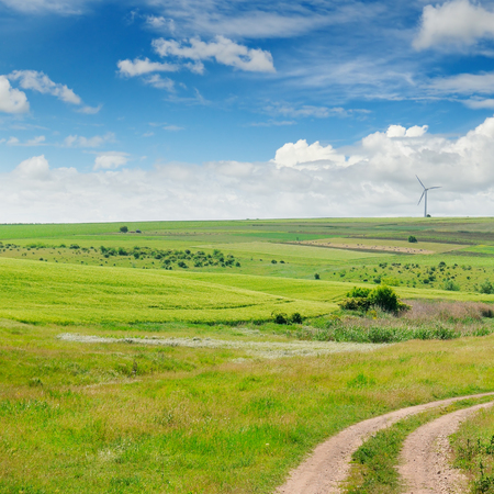 Landscape with hilly field and blue sky. Agricultural landscape.の写真素材