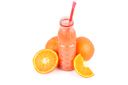 A fruit of orange and a bottle with juice isolated on white background. Free space for text.の写真素材