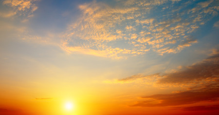 Cloudy sky and bright sunrise over the horizon. Wide photo.の写真素材