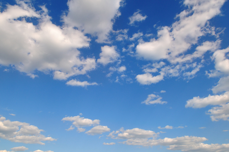 Light cumulus clouds in the blue sky. A bright sunny day.の写真素材