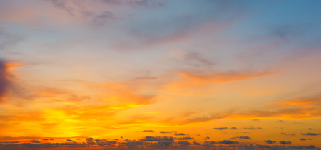 Cloudy sky and bright sunrise over the horizon.の写真素材