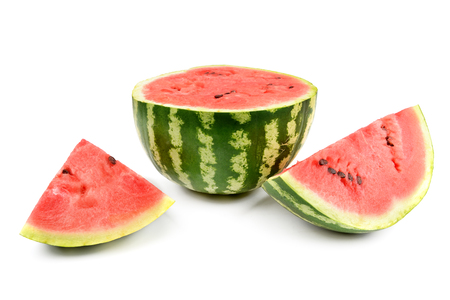 Ripe round watermelon and half a berry isolated on white background.の写真素材