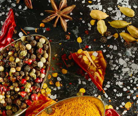 Variety of spices and herbs on kitchen table. Flat lay, top view.の写真素材
