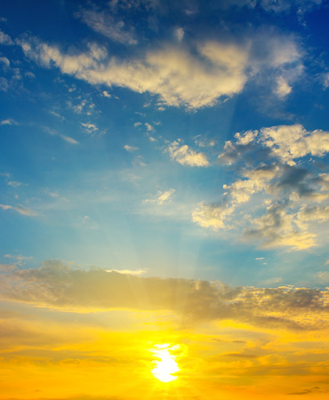 Cloudy sky and bright sunrise over the horizon.の写真素材