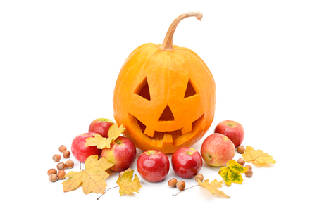 Pumpkin-head, nuts, apples and yellow leaves isolated on white background. Halloween is a fun holiday.の写真素材
