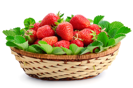 Appetizing strawberries in a wicker basket isolated on white background.の写真素材