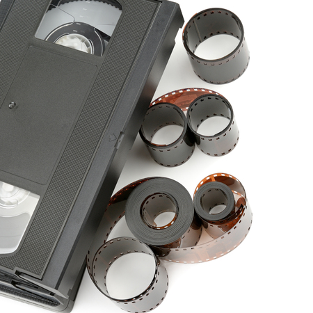 A set of video tapes and photographic film isolated on white background. Flat lay, top view. Retro equipment.の写真素材
