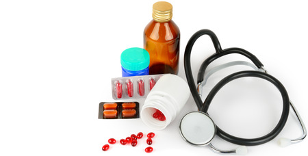 Stethoscope, pills and medical preparations isolated on white background. Free space for text. Wide photo.の写真素材