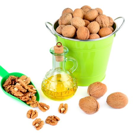 Oil of walnut and nut fruit isolated on white background. Organic food.の写真素材