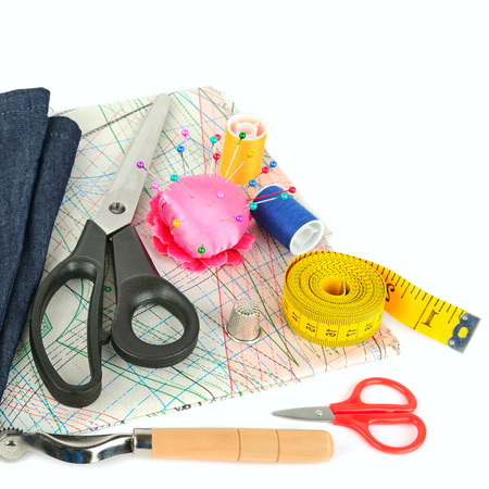 Sewing accessories and paper pattern isolated on white background. Flat lay, top view. Free space for text.の写真素材