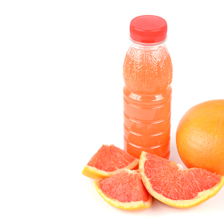 A fruit of grapefruit and a bottle with juice isolated on white background. Free space for text.の写真素材