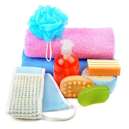 Cotton towels, cosmetic soap, sponge and shampoo isolated on white background.の写真素材
