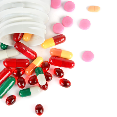Assorted pharmaceutical medicine pills, tablets and capsules isolated on white background. Flat lay, top view. Free space for text.の写真素材