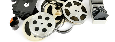 Old photo and video equipment isolated on white background. Retro storage media. Wide photo.の写真素材