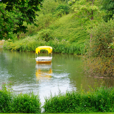 Picturesque lake and boats for walking. Summer Park.の写真素材