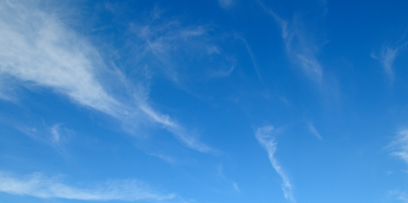 Light cumulus clouds in the blue sky. Wide photo.の写真素材