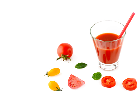 Fresh tomato juice and tomatoes isolated on white background. Flat lay,top view. Free space for text. Healthy food.の写真素材