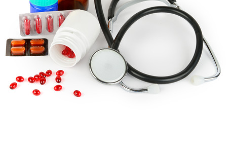 Stethoscope, pills and medical preparations isolated on white background. Free space for text. Flat lay, top view.の写真素材