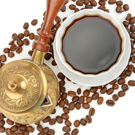 Coffee pot and cup of coffee isolated on white background. Flat lay, top view.の写真素材