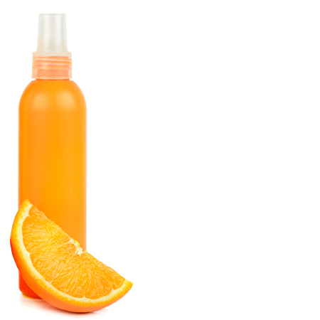 Orange natural cosmetic products: Suntan oil and lotion. Vials isolated on white background.の写真素材