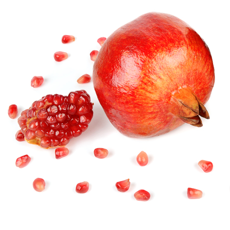 Pomegranate fruit and seeds isolated on whiteの写真素材
