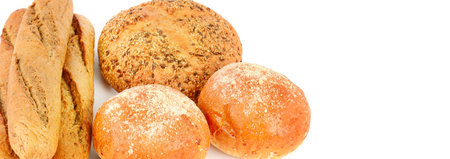 Various of bread and bakery products isolated on white background. Free space for text. Wide photo.