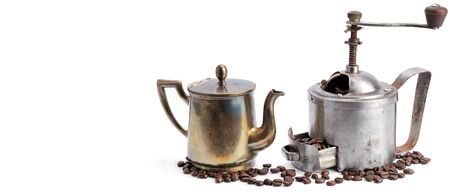 Old coffee pot, grinder coffee and beans isolated on white background. Free space for text. Wide photo.の写真素材