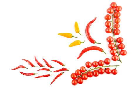 Cherry tomatoes, cayenne and chili pepper isolated on a white background. Colorful background. View...