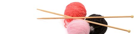 Balls of wool and knitting needles isolated on white background. Free space for text. Wide photo .の写真素材