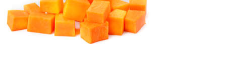 Slices of appetizing pumpkin isolated on a white background. Wide photo. Free space for text.の写真素材