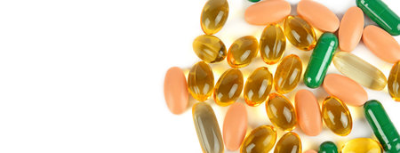 Pills and tablets isolated on white background. Free space for text. Wide photo.