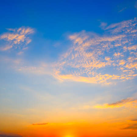 Gorgeous scenic of the strong sunrise and cloud on the orange sky.の写真素材