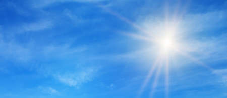 blue sky, sun and beautiful natural white clouds. Wide photo.の写真素材