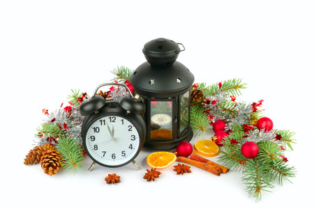 Christmas decor: alarm clock, lantern, spruce twigs, Christmas balls, cones, cinnamon sticks, star...