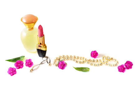 Perfume bottle ,lipstick and pearl jewelry isolated on white background. Free space for text.