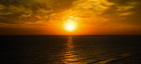 Sunrise over the sea background. Colorful ocean beach. Wide photo.の写真素材
