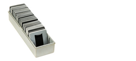 Photo slides in a box isolated on a white background. Free space for text. Wide photo.の写真素材