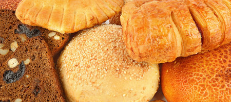 Background from a set of buns and sweet pastries. Wide photo.の写真素材