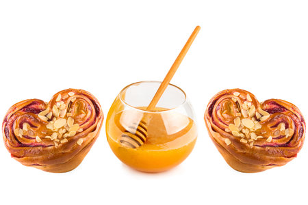 Sweet pastries and bee honey isolated on white background. Collage.の写真素材