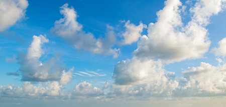 Blue sky and light cumulus clouds. wide photo.の写真素材