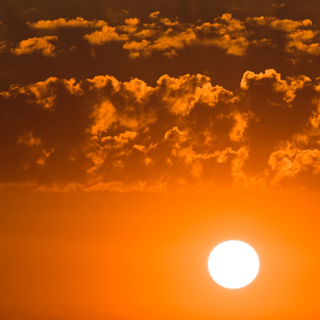 Bright red sunrise and a beautiful cloudy sky.の写真素材